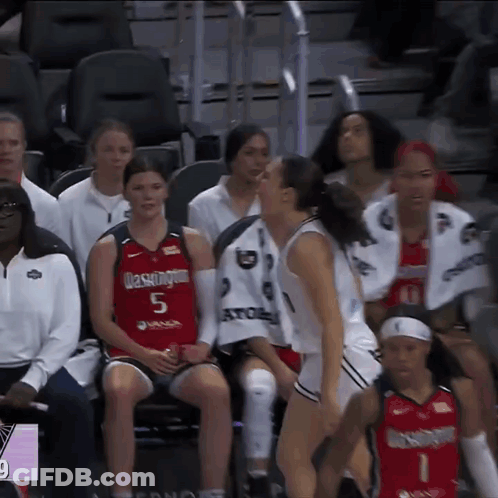 Woman In Washington Jersey Sitting On Bench GIF