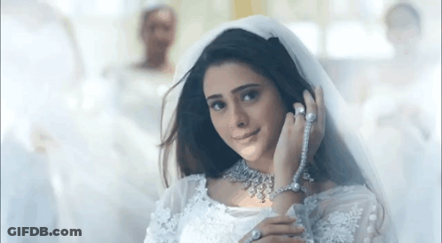 Woman In Wedding Dress And Veil Smiling GIF