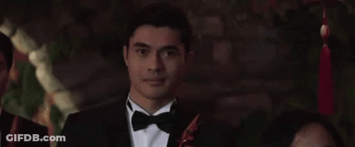 Woman In Wedding Dress Crying With Sparkler At Party GIF