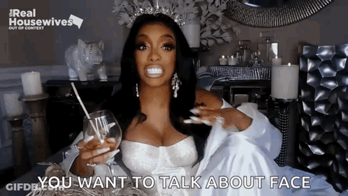 Woman In Wedding Dress Holding Glass Of Wine And Straw GIF