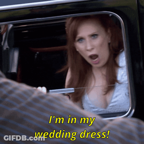 Woman In Wedding Dress Talking To Man GIF