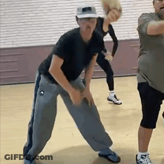 Woman In Wheelchair Dancing With Man In Front Of DWTS Sign GIF