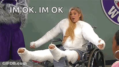 Woman In Wheelchair With Cast On Leg And Arm GIF