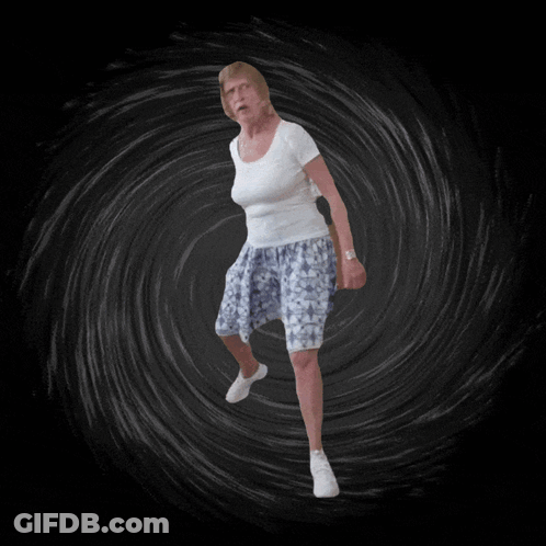Woman In White And Blue Dancing In Dark Room GIF