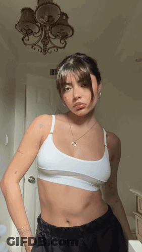 Woman In White Bra And Black Shorts GIF