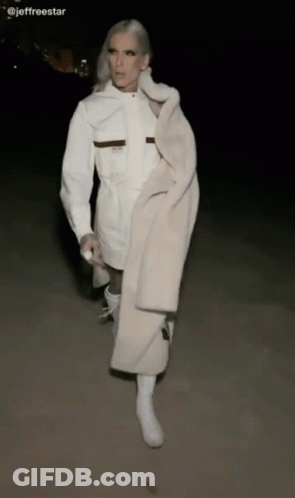Woman In White Coat And Boots Walking GIF