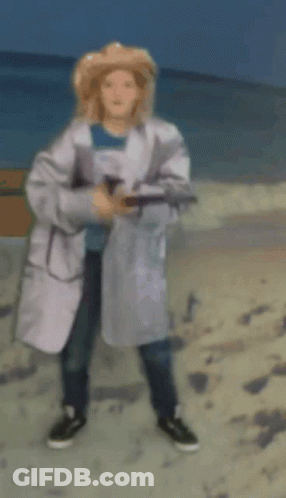 Woman In White Coat And Straw Hat On Beach GIF