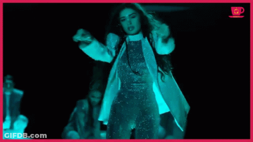 Woman In White Coat In Dark Room GIF