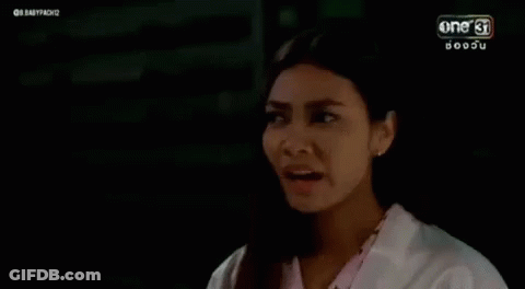 Woman In White Coat Making Funny Face GIF