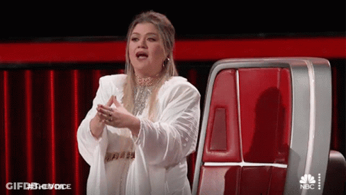 Woman In White Coat On The Voice GIF
