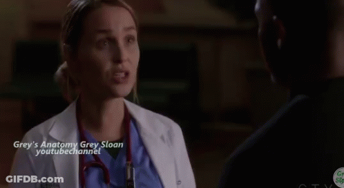 Woman In White Coat Talking To Man In Hospital Room GIF