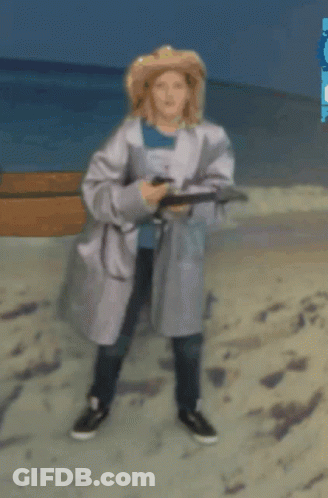 Woman In White Coat Walking On Beach GIF