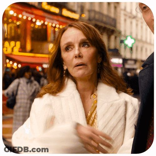 Woman In White Coat With M2 Sign GIF