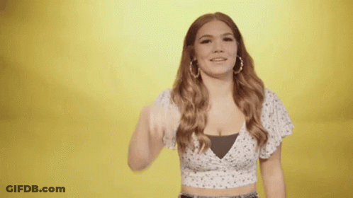 Woman In White Crop Top Giving Thumbs Up GIF