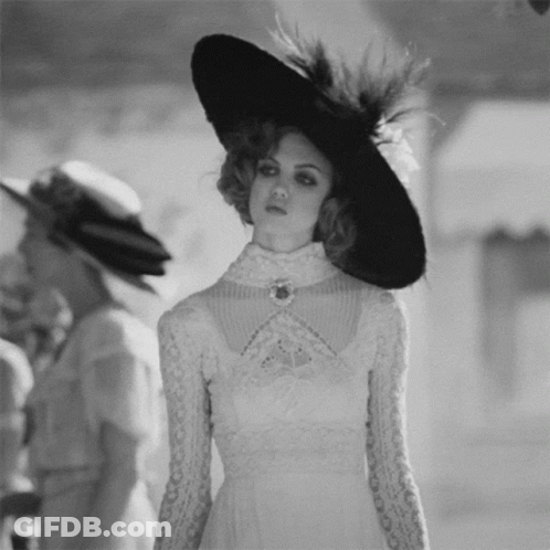 Woman In White Dress And Black Hat GIF
