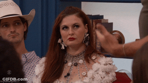 Woman In White Dress And Cowboy Hat In Crowd GIF