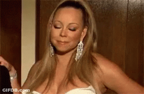 Woman In White Dress And Earrings Standing In Room GIF