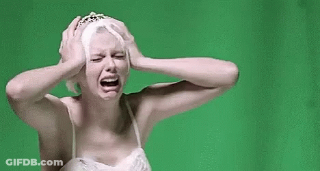 Woman In White Dress And Tiara Crying Holding Head GIF