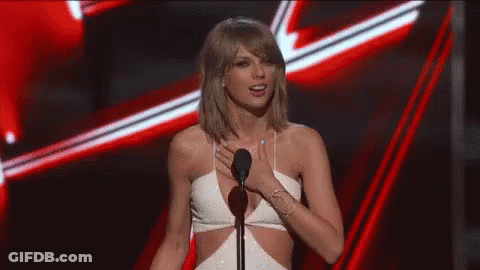 Woman In White Dress At Microphone GIF