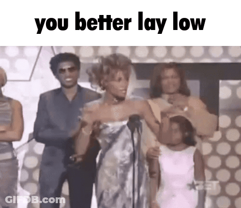 Woman In White Dress At Microphone GIF