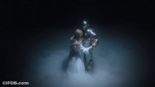 Woman In White Dress Beside Knight In Armor GIF