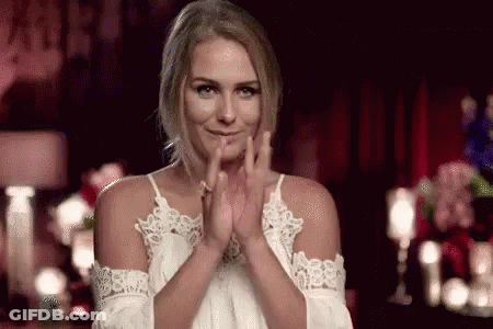 Woman In White Dress Clapping In Dark Room GIF