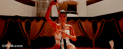 Woman In White Dress Covered In Blood Holding Bottle GIF