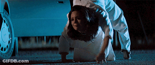 Woman In White Dress Crawling In Front Of Car GIF