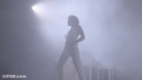 Woman In White Dress Dancing In Fog GIF