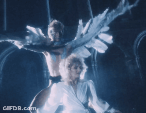Woman In White Dress Dancing With Man With Wings GIF