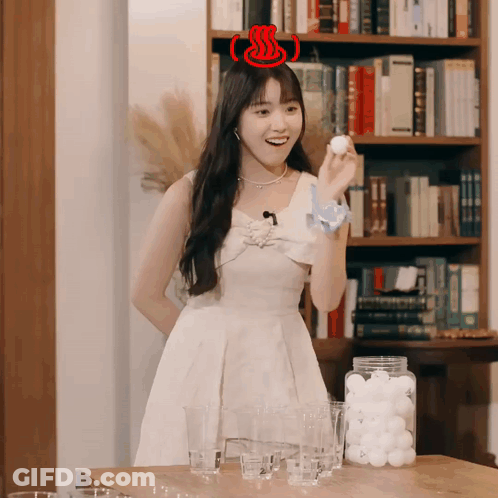 Woman In White Dress Holding Ball GIF