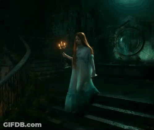 Woman In White Dress Holding Candle GIF