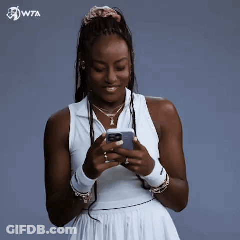 Woman In White Dress Holding Cell Phone GIF