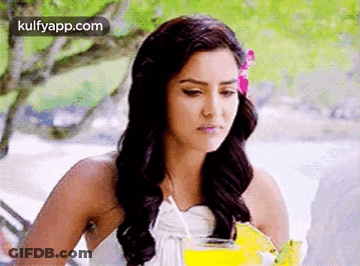 Woman In White Dress Holding Drink GIF