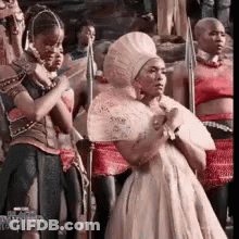 Woman In White Dress Holding Fan GIF