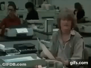 Woman In White Dress Holding Microphone In Front Of SNL Map GIF