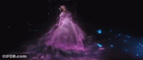 Woman In White Dress Holding Wand In Rain GIF