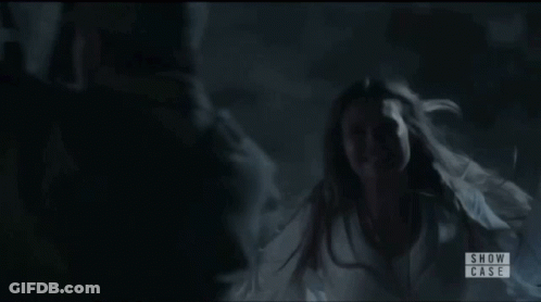 Woman In White Dress In Dark Room Show Case GIF