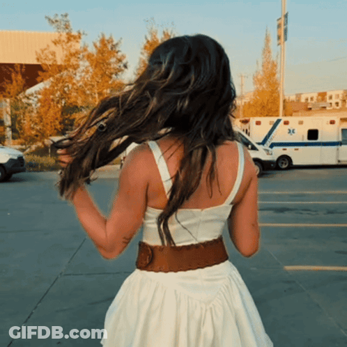 Woman In White Dress In Front Of Ambulance 32 GIF