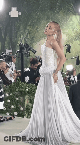 Woman In White Dress In Front Of Cameras GIF
