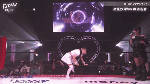 Woman In White Dress In Front Of Screen Saying Takami GIF