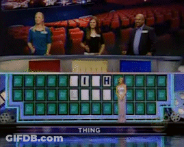 Woman In White Dress In Front Of Wheel Of Fortune Saying Thing GIF
