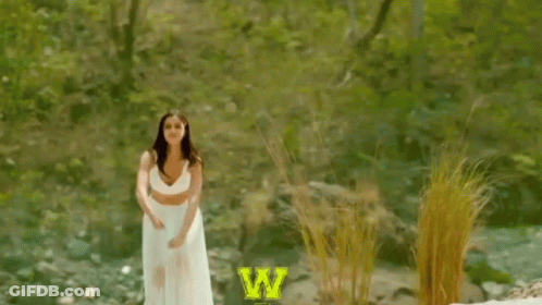 Woman In White Dress Jumping Saying Woohoo GIF