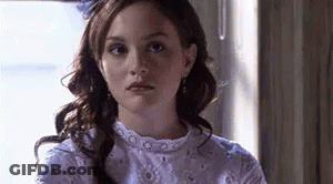 Woman In White Dress Looking At Camera GIF
