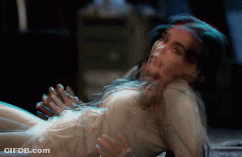 Woman In White Dress Lying On Floor With Hands Outstretched GIF