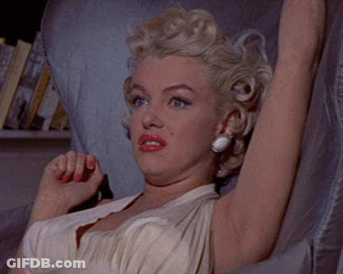 Woman In White Dress Making A Face GIF
