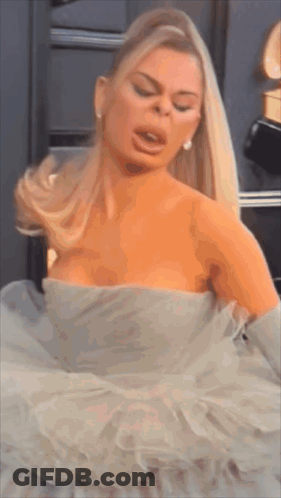 Woman In White Dress Making Face GIF