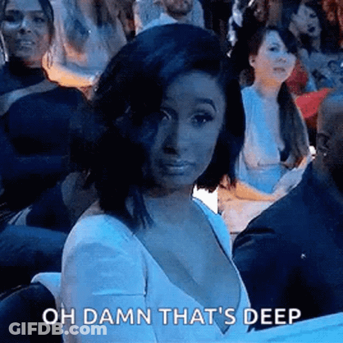 Woman In White Dress Making Funny Face In Crowd GIF