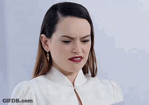 Woman In White Dress Making Funny Face GIF