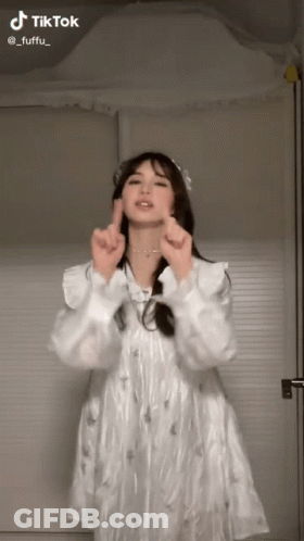 Woman In White Dress Making Heart GIF